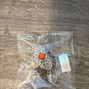 Ornate Silver-Tone Ring with Orange Stone